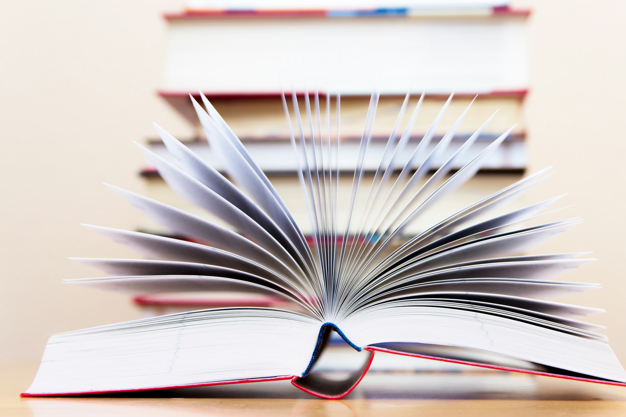 Open book on the background of books.